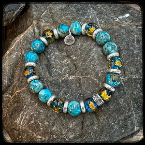 Bracelet EL MONDO Perles 10mm turquoise naturelle. Motif DONUT