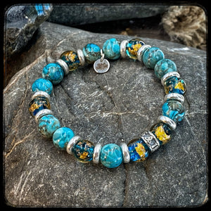 Bracelet EL MONDO Perles 10mm turquoise naturelle. Motif DONUT