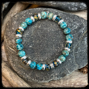 Bracelet EL MONDO Perles 8mm turquoise naturelle. Motif DONUT
