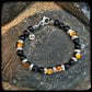 Bracelet FIREBALL Perles 8mm onyx noir Fermoir argent 925. Motif DONUT