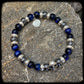 Bracelet LAGUNA BEACH Perles 8mm œil de tigre bleu et térahertz, argent 925. Motif SKULL