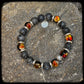 Bracelet MAGMA Perles 10mm larvikite et argent 925. Motif SKULL