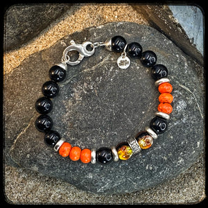 Bracelet MILWAUKEE Perles 10mm onyx noir et magnésite Fermoir argent 925. Motif DONUT