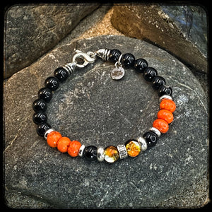 Bracelet MILWAUKEE Perles 8mm onyx noir et magnésite Fermoir argent 925. Motif DONUT