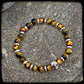 Bracelet TENNESSEE Perles 8mm.Œil de tigre jaune et argent 925. Motif SKULL